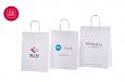 Valged paberist kotid on s.. | Fotogalerii- valged paberkotid, millele trkitud klientide logod Va